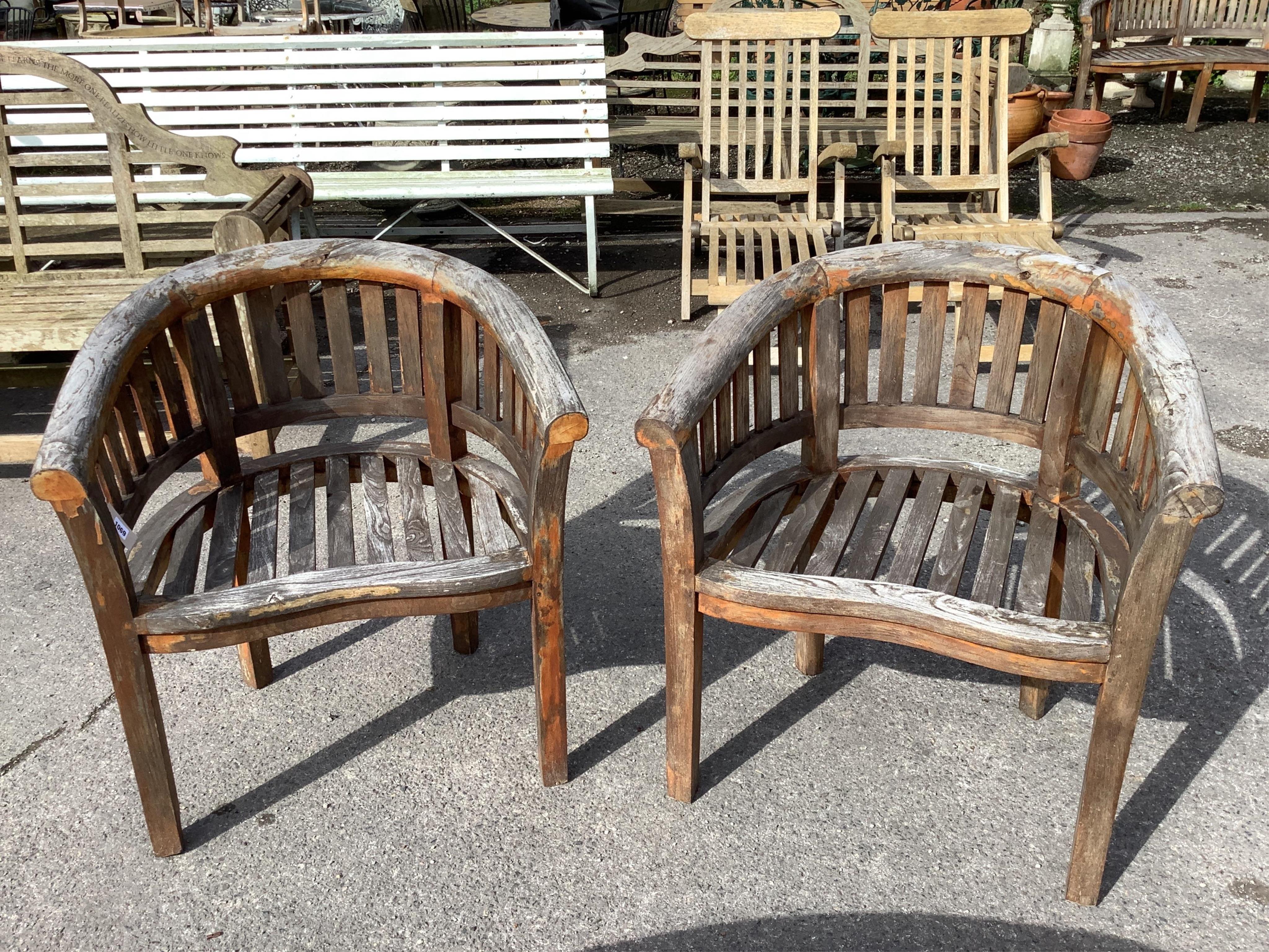 A weathered teak garden 'banana' bench, width 150cm, depth 60cm, height 84cm, a pair of chairs and coffee table